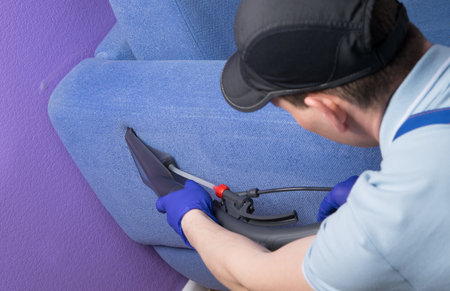 the cleaning company is engaged in cleaning of the apartment and upholstered furniture, full cleaning, a vacuum cleaner with wet cleaningの写真素材