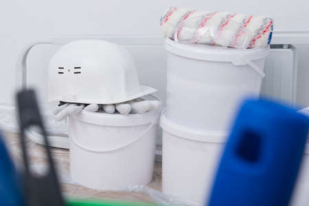 close-up of paint buckets and wall repair toolsの写真素材