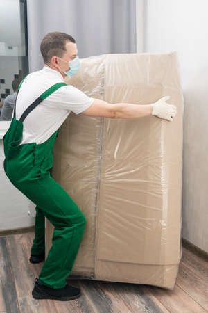 a loader brought a large purchase into the buyer's apartmentの写真素材