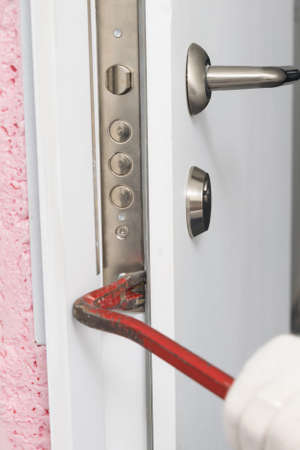 opening the front door with a special toolの写真素材
