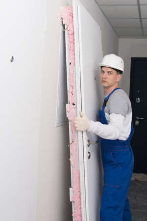 worker made dismantling of the old door, side viewの写真素材