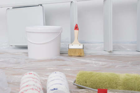 rollers and brushes for painting walls, background close-upの写真素材