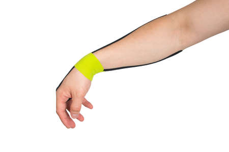 the  tape is pasted on the arm, to protect against injury during sports, on a white backgroundの写真素材