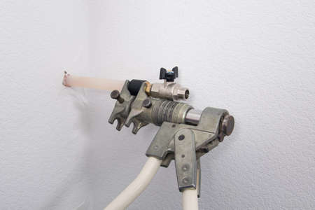 close-up of the installation of the locking coupling, on a plastic pipe for fixing the transitionの写真素材