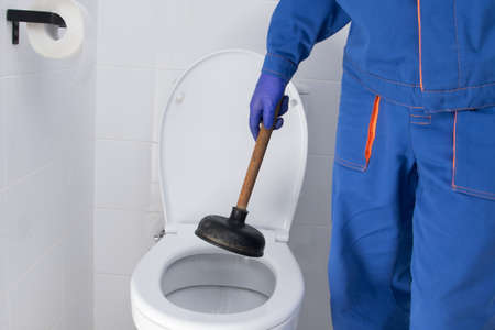 removal of a blockage of the toilet sewer, by the cleaning companyの写真素材