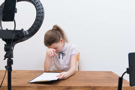 the girl blogger adjusts to the video, reading the script, there is a place for the inscriptionの写真素材