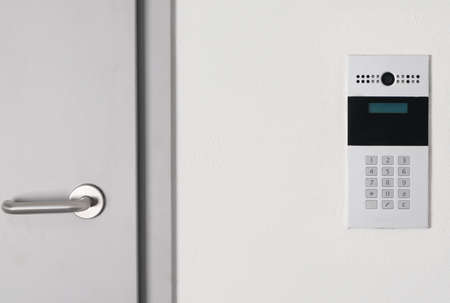 intercom with video communication in the wall for opening the door to the hall, close-upの写真素材