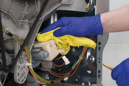 maintenance and cleaning of the complex mechanism of electrical componentsの写真素材
