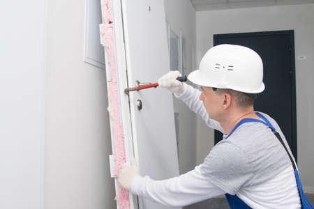 after breaking the lock, the dismantled door is tried to open with a special tool for hackingの写真素材