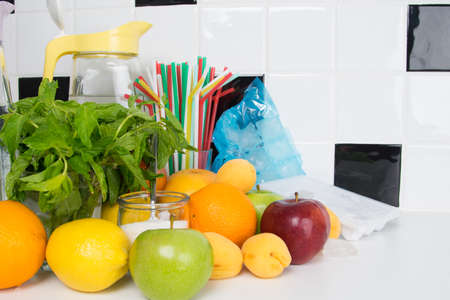 a set of fruits and herbs for making drinks in a jug, there is a place for an inscriptionの写真素材