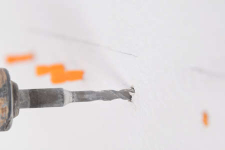 concrete wall is drilled with a puncherの写真素材