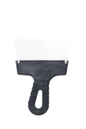 metal spatula with teeth, for applying tile glue and mortarの写真素材