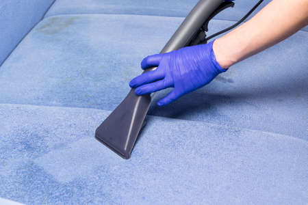 cleaning of upholstered furniture with a washing vacuum cleaner, professional cleaningの写真素材