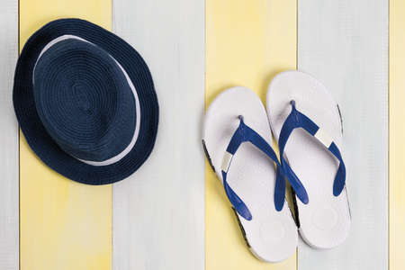 blue hat and flip flops for relaxing on the beachの写真素材