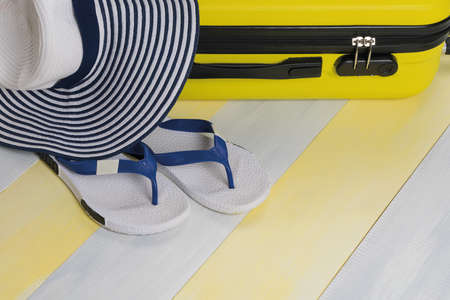 travel concept: suitcase and summer things for relaxing in warm countriesの写真素材