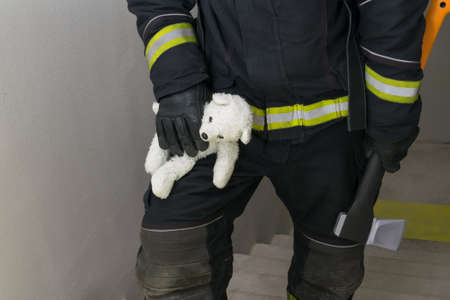 the firefighter connects the water supply lines to the fire siteの写真素材