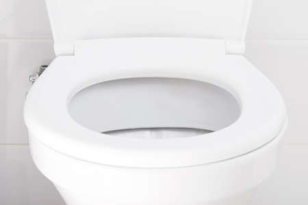 white toilet rim, front view, close-upの写真素材