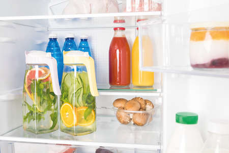 refreshing drinks on the shelf in the refrigerator, front viewの写真素材