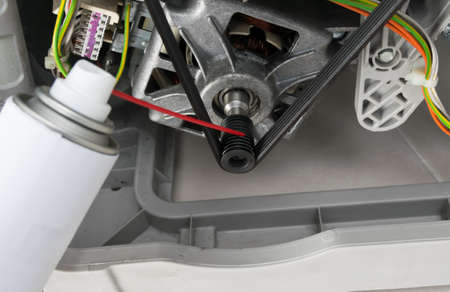 the process of lubricating moving elements, washing machine components, close-upの写真素材
