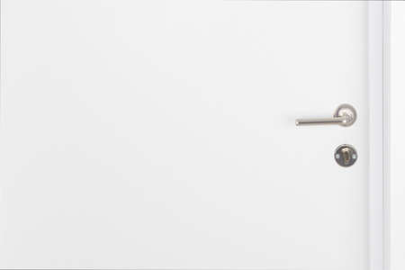 white exit door with handle, close-upの写真素材