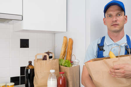 courier delivery of food to your kitchenの写真素材
