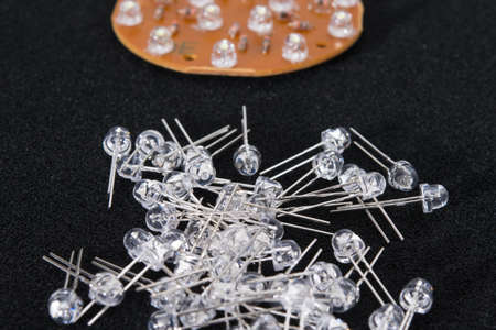 set of LEDs with long contacts, for repair and replacement, on a black background, close-upの写真素材