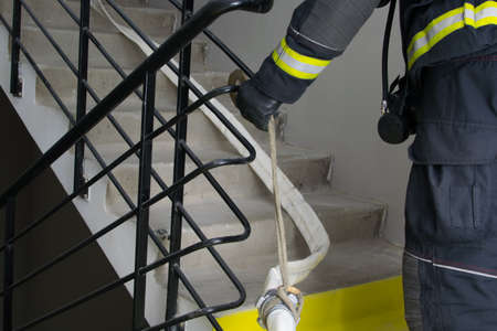 a sleeve for water supply, a hose, a hook with a rope is placed, a delay, to hold a large weight of the fire lineの写真素材