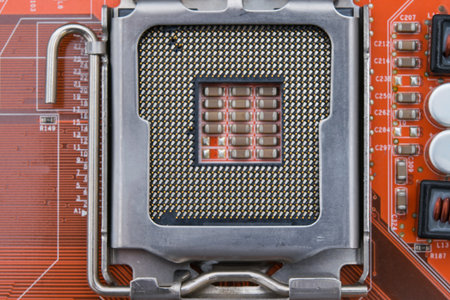 processor with contacts on a red microcircuit, close-up, backgroundの写真素材