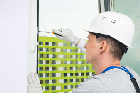 the master adjusts the windows before winterの写真素材