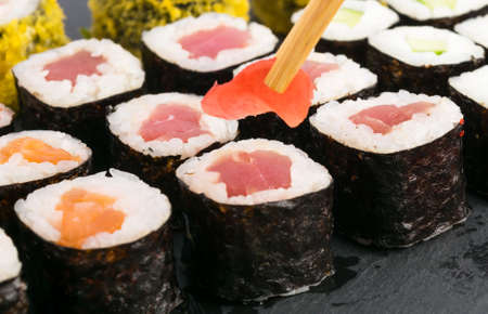 chinese sticks put ginger on rolls, close-upの写真素材