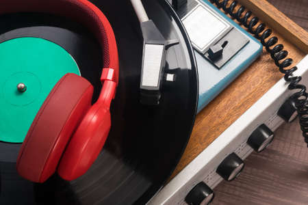 red headphones for listening to old vinyl recordsの写真素材