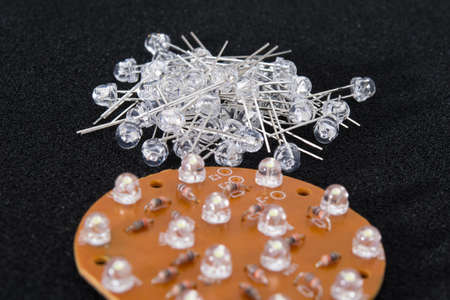 a set of LEDs with long contacts and a cover for them, close-upの写真素材