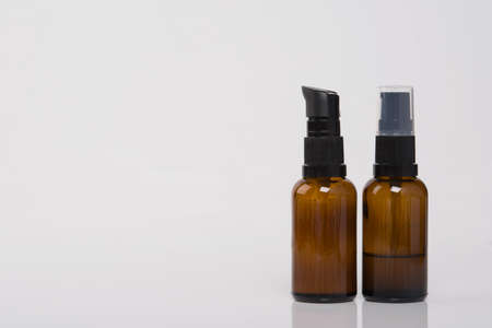 on a white background, with a place for an inscription, two bottles of massage oilの写真素材