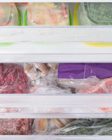 frozen food in freezer drawers, top viewの写真素材