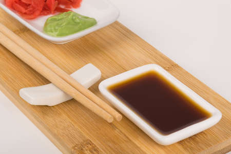 sushi food set with soy sauce and spices, front viewの写真素材