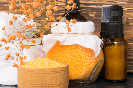 concept in orange for advertising spa treatments: creams, towels and bath saltsの写真素材