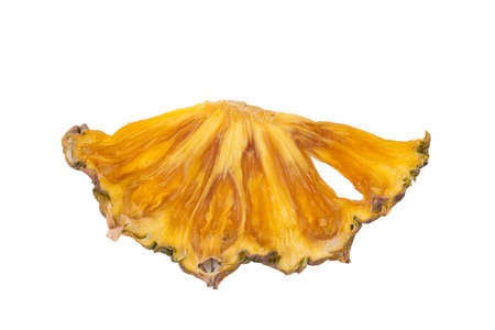 sliced piece of dried pineapple, close-up, on a white backgroundの写真素材