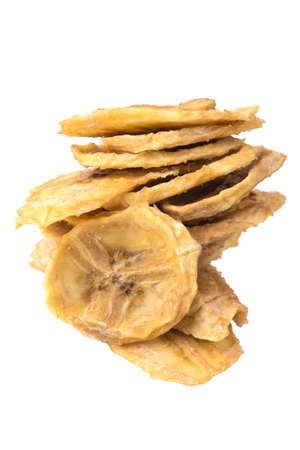 dried bananas, cut into round pieces, on a white background, close-upの写真素材