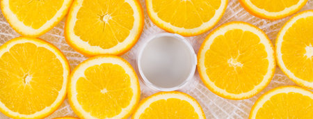on a white round grate, sliced orange fruit, for further drying, close-upの写真素材