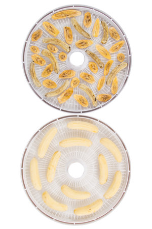 on a white background, two round grids, dried peeled bananas and freshの写真素材