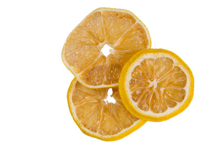 sliced dried lemon slices, close-up, on a white backgroundの写真素材