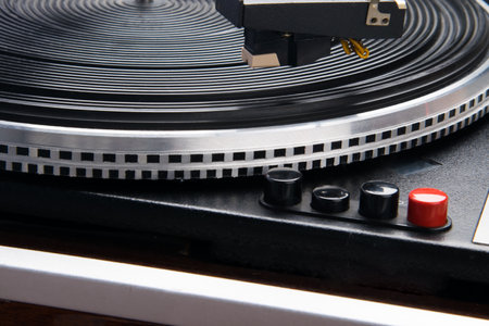 close-up of black and red buttons, on a turntable for vinyl recordsの写真素材
