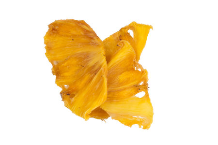 sliced dried pineapple fruit, close-up, on a white backgroundの写真素材