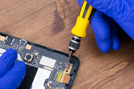 close-up of electronics repair, replacement and diagnostics of faulty partsの写真素材