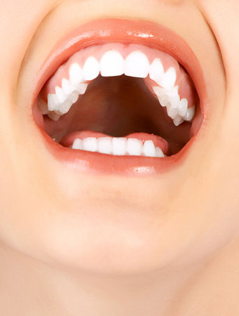 Beautiful young woman teeth. Isolated over  white background