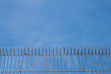 fence spike and the skyの写真素材