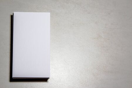 White business card on black background. Business card blank. Mockup white business card on black background. Stack of blank white business cards black backgroundの写真素材