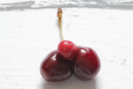Cherry. Fresh organic berries. Ripe cherries on a white background. Healthy breakfast. Healthy food. Top view.の写真素材