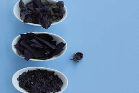 Three stages of Basil: fresh, dried and crushed. Top view. Flat lay. Copy space. Horizontal...