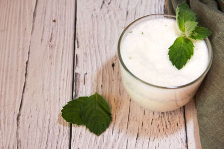 Milkshake with Ice Cream and Mint on wooden background.の写真素材